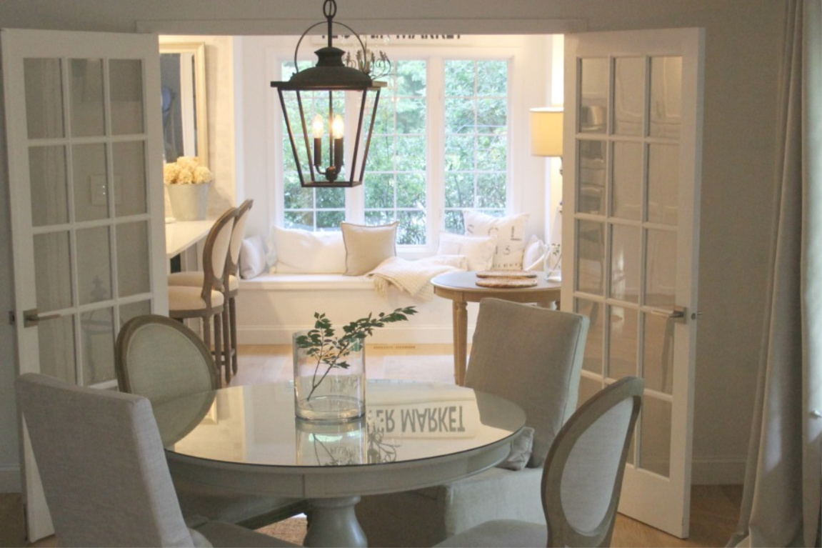 European country dining room with lantern pendant, round table, and Belgian linen upholstered chairs. #hellolovelystudio #diningroom #europeancountry #countryfrench #interiordesign