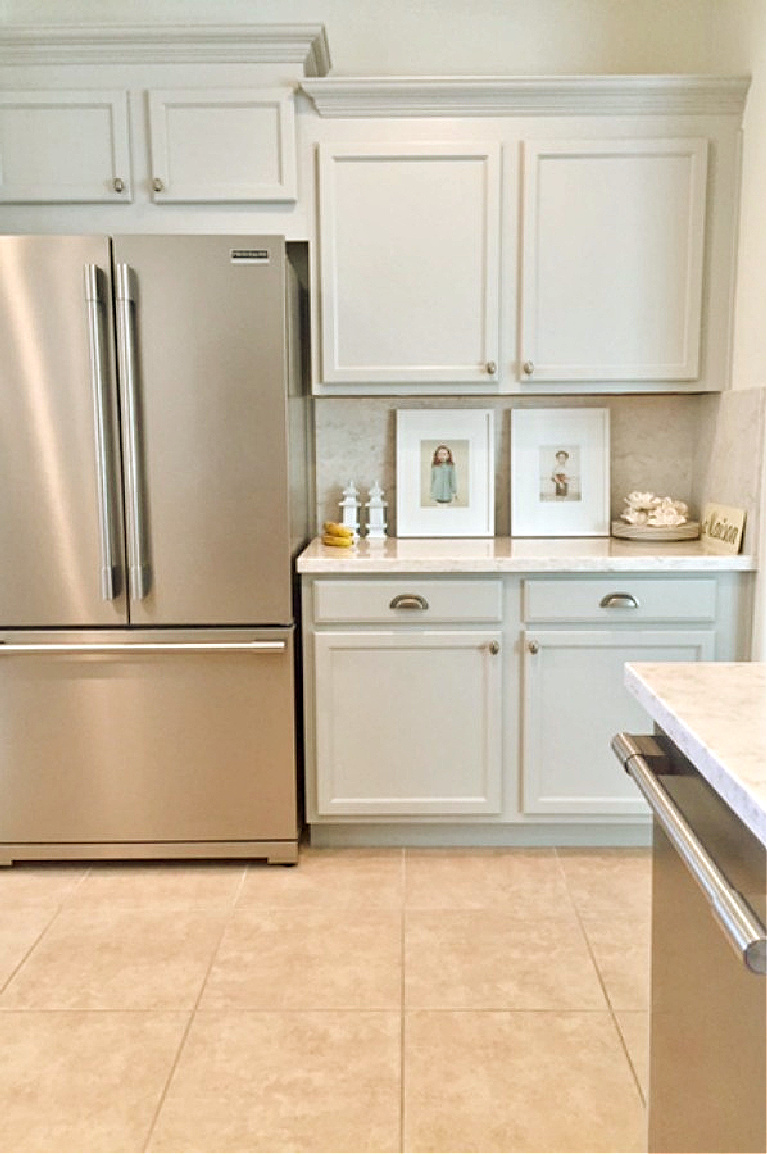 Hello Lovely's Kitchen Makeover with Viatera Soprano quartz counters, Kitchenaid stainless appliances, and blue grey cabinets. #hellolovelystudio #kitchenmakeover #diykitchendesign #paintedcabinets #viaterasoprano #whitequartzcounters #kitchenaidappliances