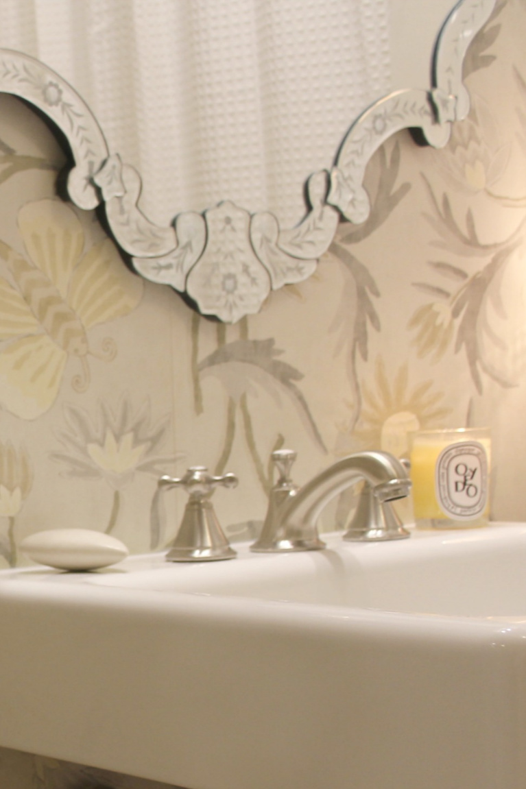 Console sink with fireclay farm sink top and Thibaut wallpaper with butterflies in a traditional style bathroom. #hellolovelystudio #bathroomdesign #consolesink #fireclaysink #thibaut #lizzette #wallpaper