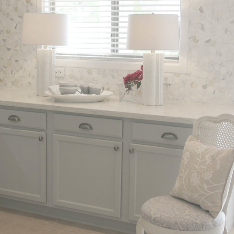 Serene kitchen with grey cabinets, calacatta marble hex tiled backsplash and Viatera Soprano countertop. #hellolovelystudio #viatera #soprano #calacattagold #calacattabacksplash