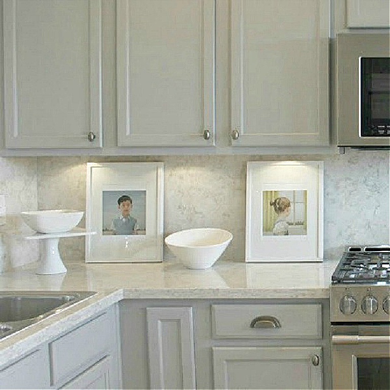 Viatera Soprano quartz kitchen counters and backsplash with Behr Classic Silver painted blue grey cabinets - Hello Lovely Studio. #viateraquartz #soprano #bluegreykitchen #kitchendesign #kitchenmakeover #serenekitchen #behrclassicsilver