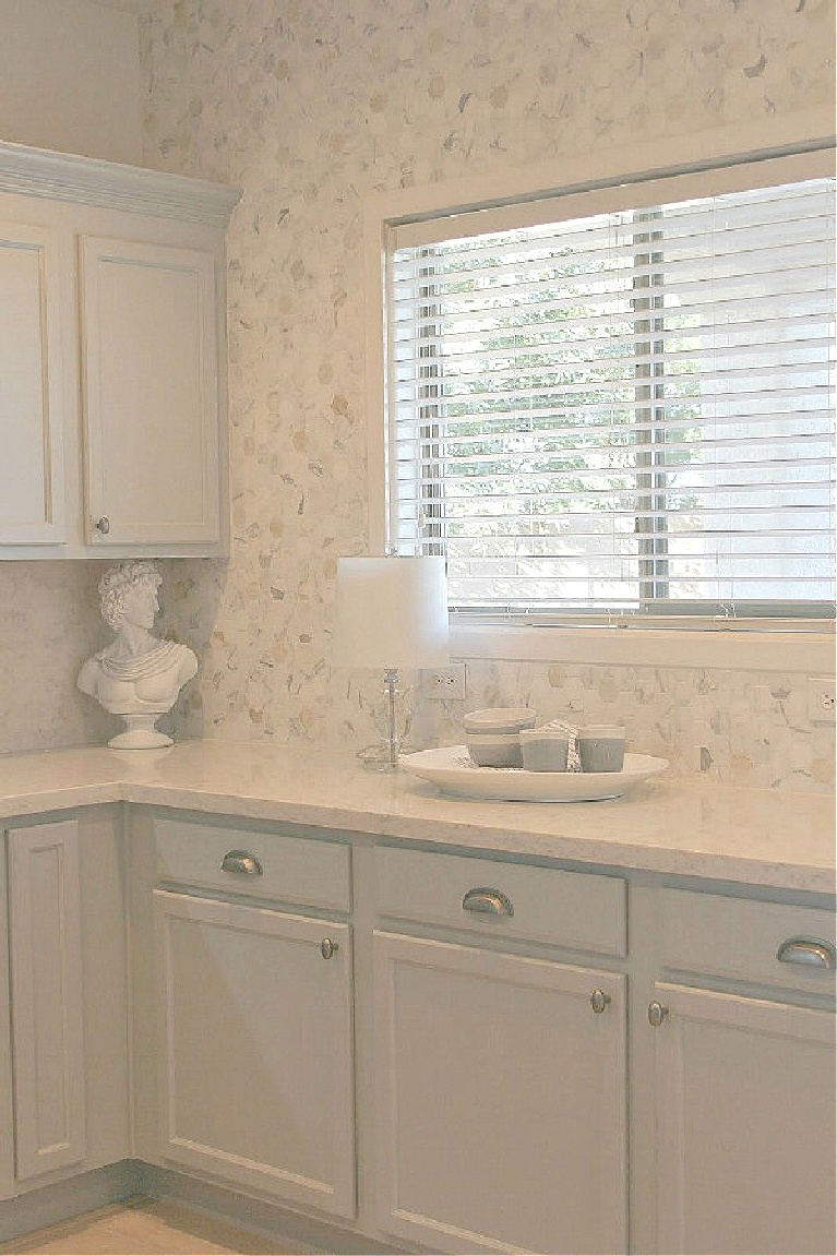 Viatera Soprano quartz kitchen counters and backsplash with Behr Classic Silver painted blue grey cabinets - Hello Lovely Studio. #viateraquartz #soprano #bluegreykitchen #kitchendesign #kitchenmakeover #serenekitchen #behrclassicsilver