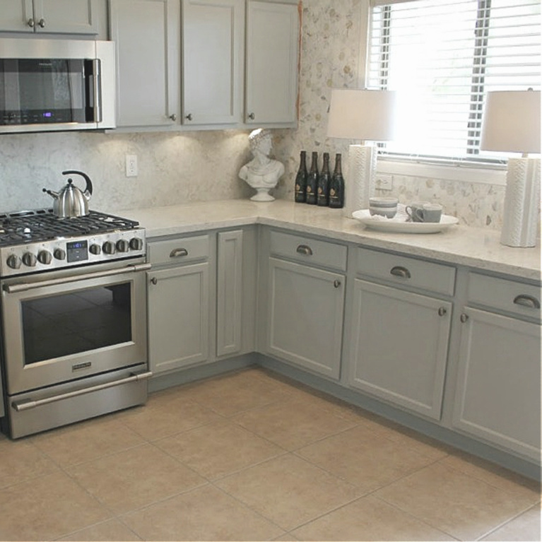 Viatera Soprano quartz kitchen counters and backsplash with Behr Classic Silver painted blue grey cabinets - Hello Lovely Studio. #viateraquartz #soprano #bluegreykitchen #kitchendesign #kitchenmakeover #serenekitchen #behrclassicsilver