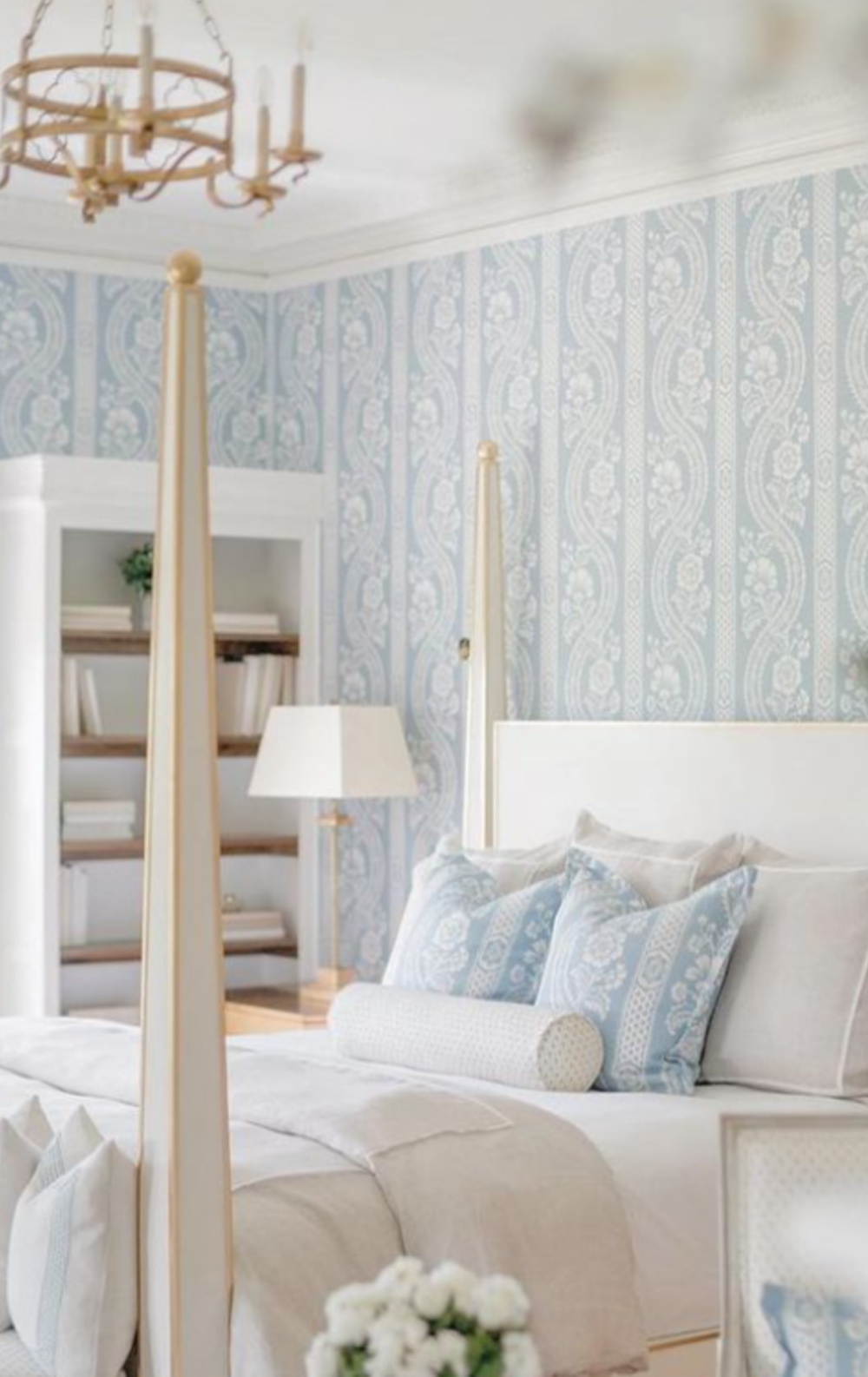 Timeless traditional interior design style in a blue wallpapered serene bedroom in Vermont by The Fox Group. #chambrayblue #bedroom #interiordesign