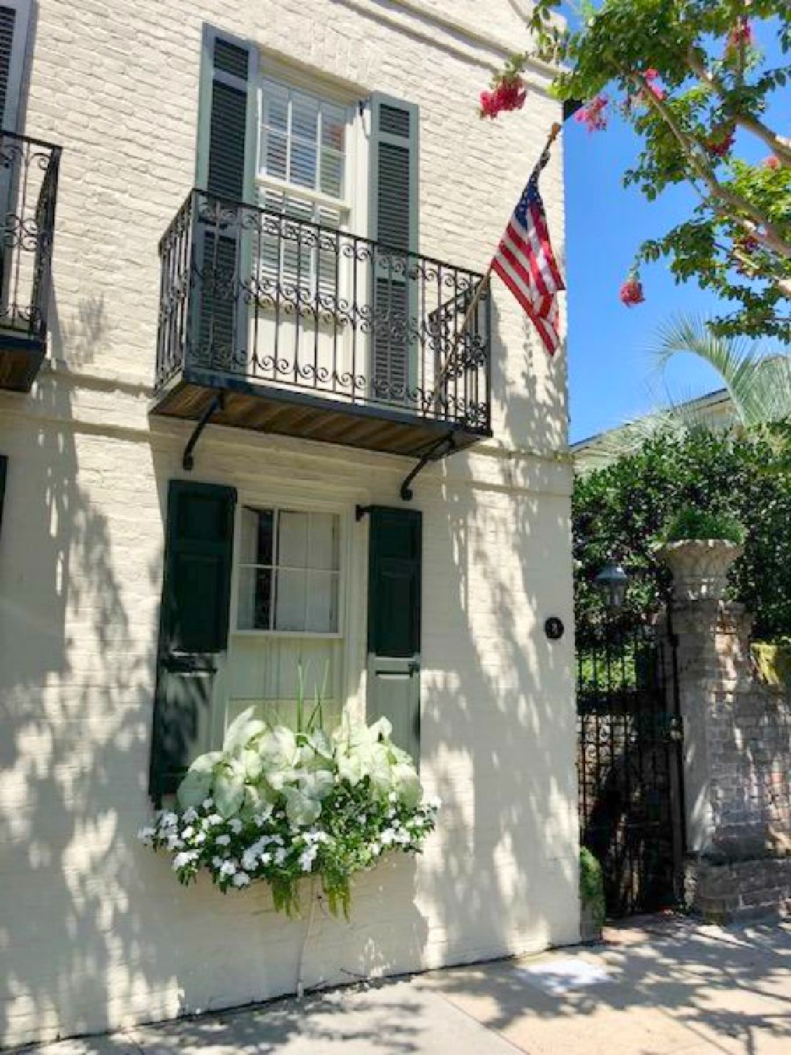 Charleston's charming historic district is graced with architecturally magnificent homes, secret gardens, lush window boxes, and colorful design inspiration. Come enjoy this photo gallery with Historic Charleston Mansion Exteriors on Hello Lovely Studio. #charlestonhomes #charlestongardens