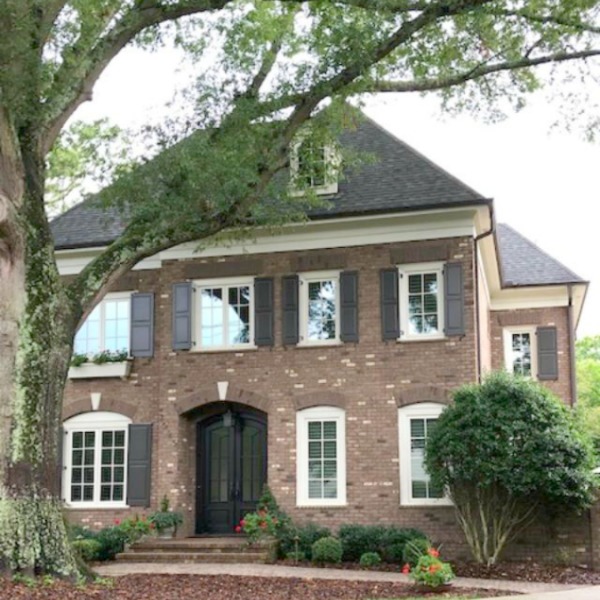 This charming home exterior in Charlotte, NC, boasts curb appeal, traditional design, and inspiring architectural details - Hello Lovely Studio.