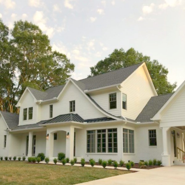 This charming home exterior in Charlotte, NC, boasts curb appeal, traditional design, and inspiring architectural details - Hello Lovely Studio.