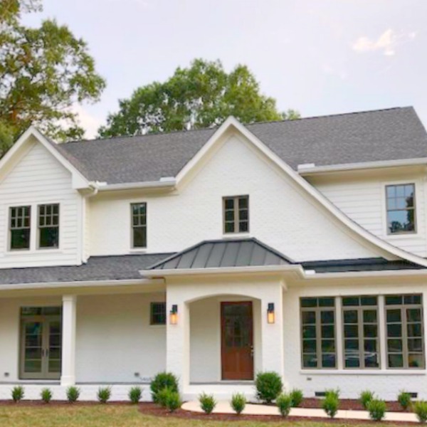 This charming home exterior in Charlotte, NC, boasts curb appeal, traditional design, and inspiring architectural details - Hello Lovely Studio.