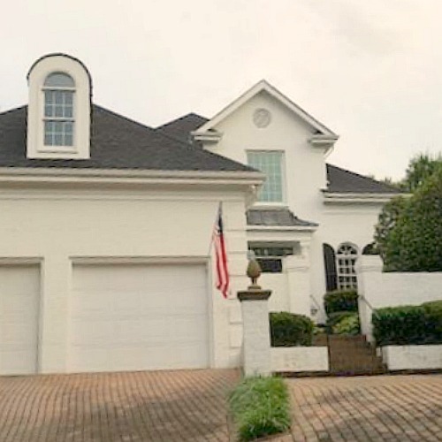 This charming home exterior in Charlotte, NC, boasts curb appeal, traditional design, and inspiring architectural details - Hello Lovely Studio.