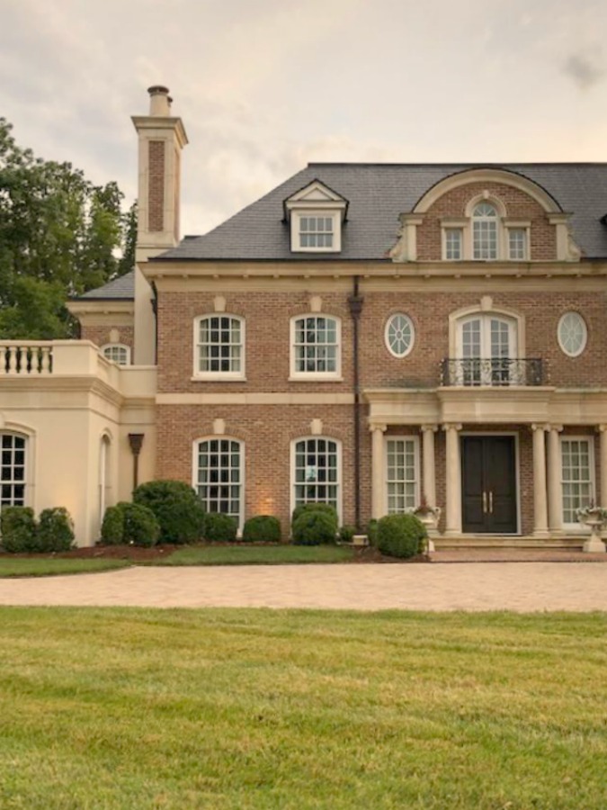 This charming home exterior in Charlotte, NC, boasts curb appeal, traditional design, and inspiring architectural details - Hello Lovely Studio.