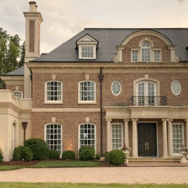 This charming home exterior in Charlotte, NC, boasts curb appeal, traditional design, and inspiring architectural details - Hello Lovely Studio.