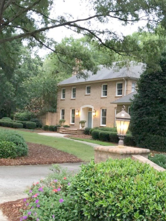 This charming home exterior in Charlotte, NC, boasts curb appeal, traditional design, and inspiring architectural details - Hello Lovely Studio.