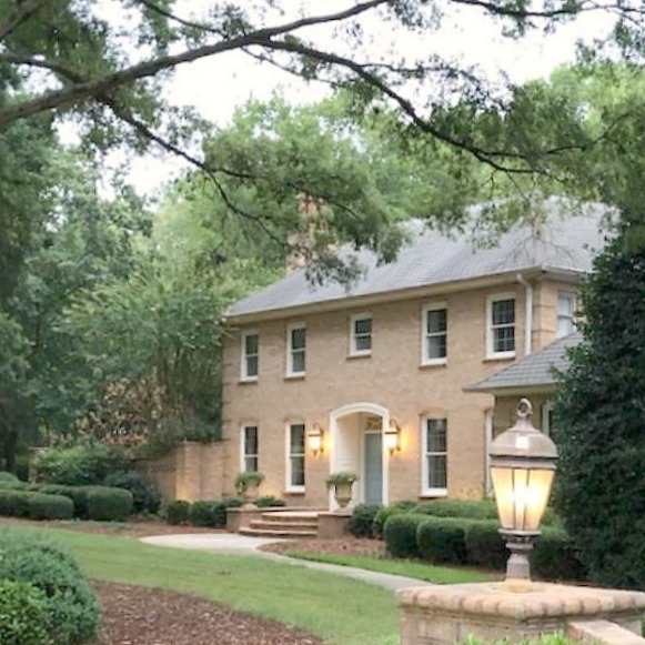 This charming home exterior in Charlotte, NC, boasts curb appeal, traditional design, and inspiring architectural details - Hello Lovely Studio.