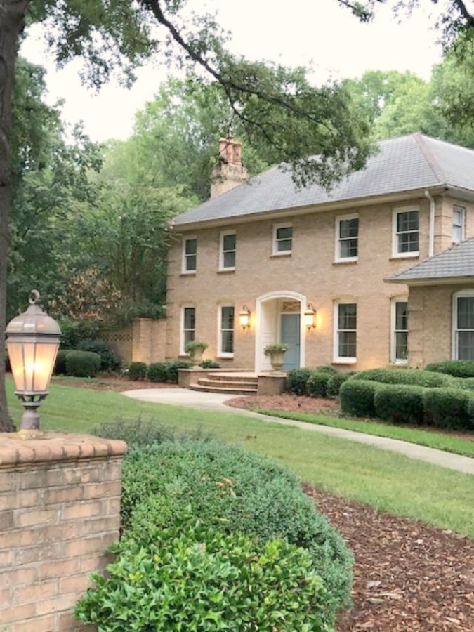 This charming home exterior in Charlotte, NC, boasts curb appeal, traditional design, and inspiring architectural details - Hello Lovely Studio.