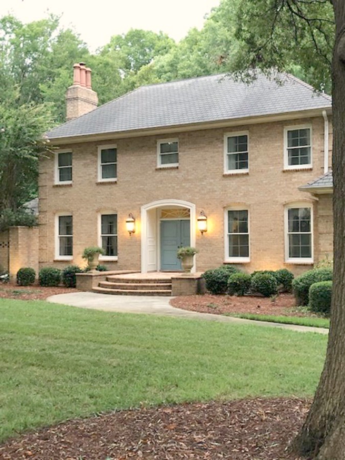 This charming home exterior in Charlotte, NC, boasts curb appeal, traditional design, and inspiring architectural details - Hello Lovely Studio.