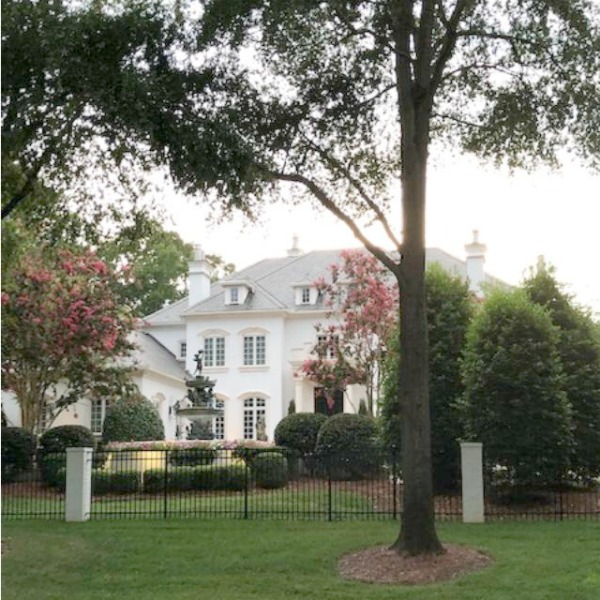 This charming home exterior in Charlotte, NC, boasts curb appeal, traditional design, and inspiring architectural details - Hello Lovely Studio.