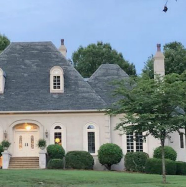 This charming home exterior in Charlotte, NC, boasts curb appeal, traditional design, and inspiring architectural details - Hello Lovely Studio.