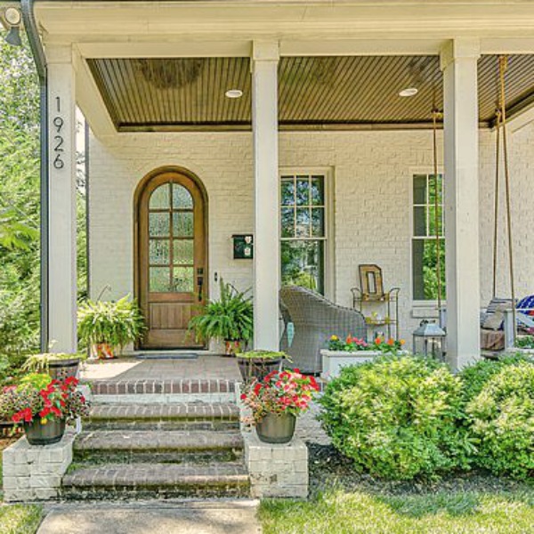 This charming home exterior in Charlotte, NC, boasts curb appeal, traditional design, and inspiring architectural details - Hello Lovely Studio.