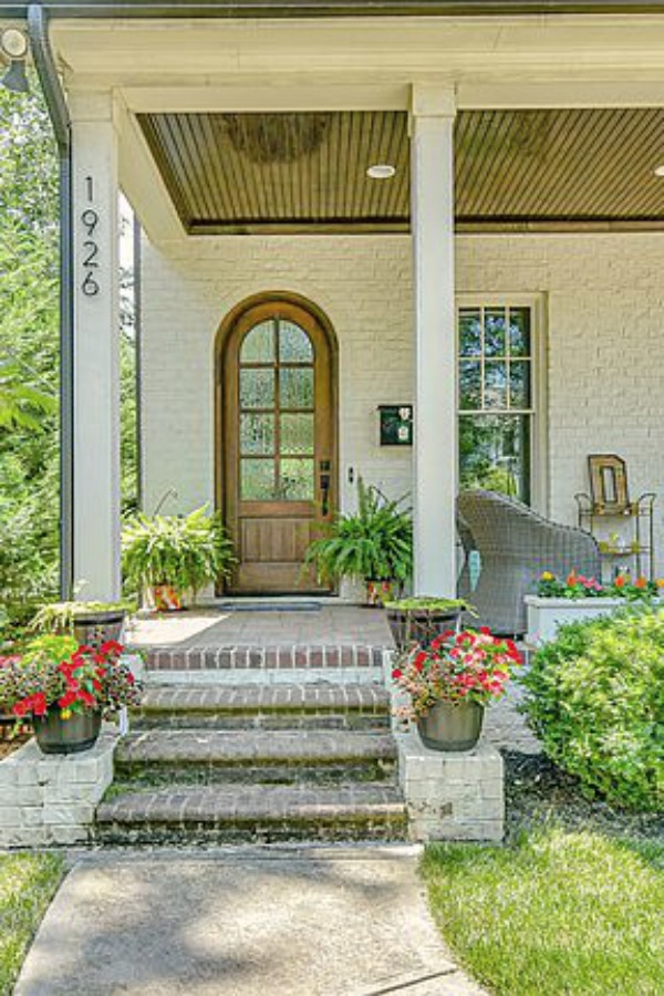 This charming home exterior in Charlotte, NC, boasts curb appeal, traditional design, and inspiring architectural details - Hello Lovely Studio.