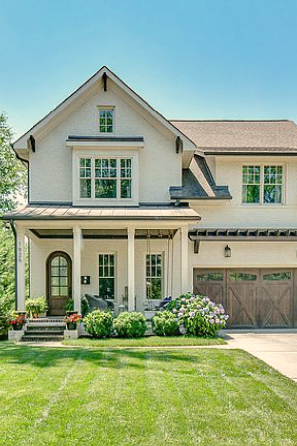 This charming home exterior in Charlotte, NC, boasts curb appeal, traditional design, and inspiring architectural details - Hello Lovely Studio.