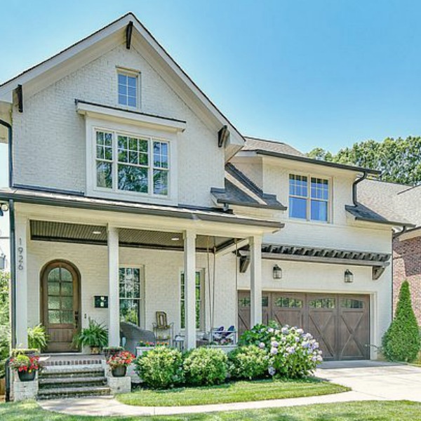 This charming home exterior in Charlotte, NC, boasts curb appeal, traditional design, and inspiring architectural details - Hello Lovely Studio.