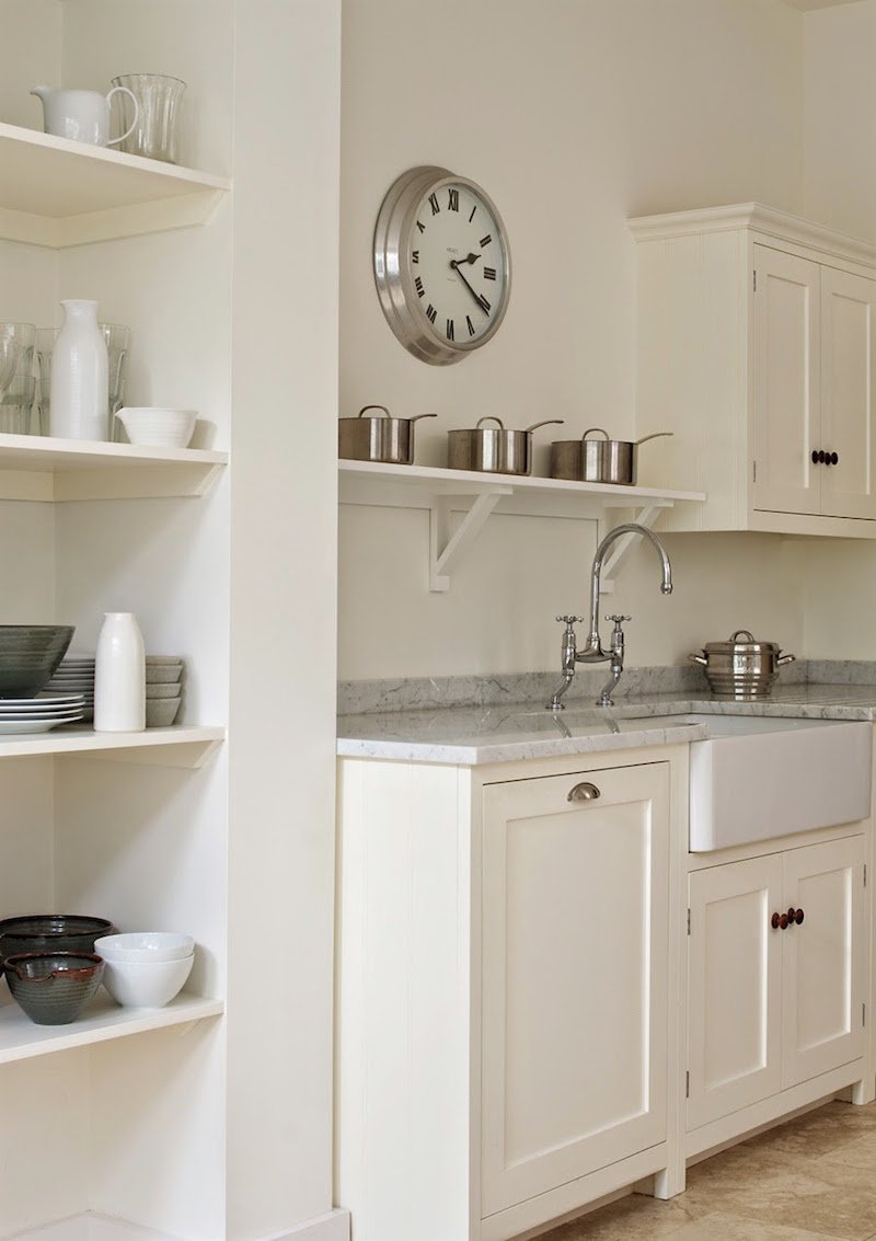 Farrow and Ball's Wimborne White paint is magical on these Shaker kitchen cabinets by bespoke furniture maker deVOL in this white country kitchen.