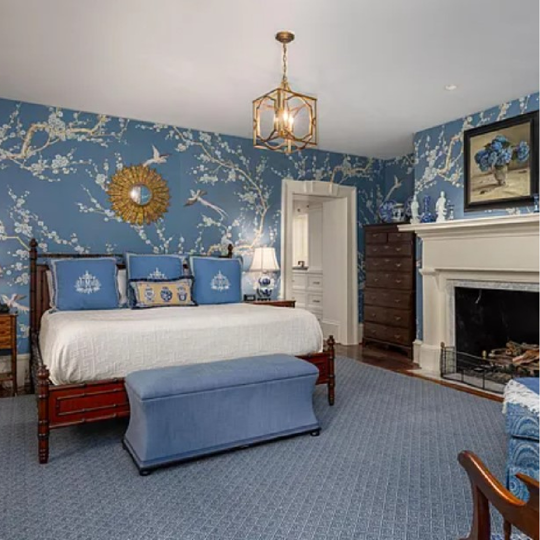 Cheerful bright blue whimsical wallpaper in a traditional bedroom at Dewar-Lee-Pringle house built in 1762. #charlestoninteriors #bluebedrooms