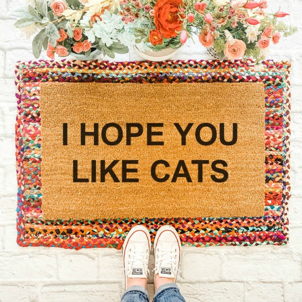 Crazy cat lovers and canoodlers of cozy kittens rejoice - you've just found the perfect mat for your front door! "I hope you like cats' is handpainted on a natural coir doormat. #catlover #doormat #layeredrugs