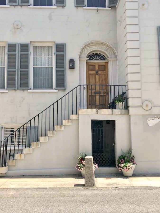 In the Battery area of Charleston, beautiful antebellum mansions with charming gardens, gates, and colorful front doors inspire with their curb appeal - Hello Lovely Studio