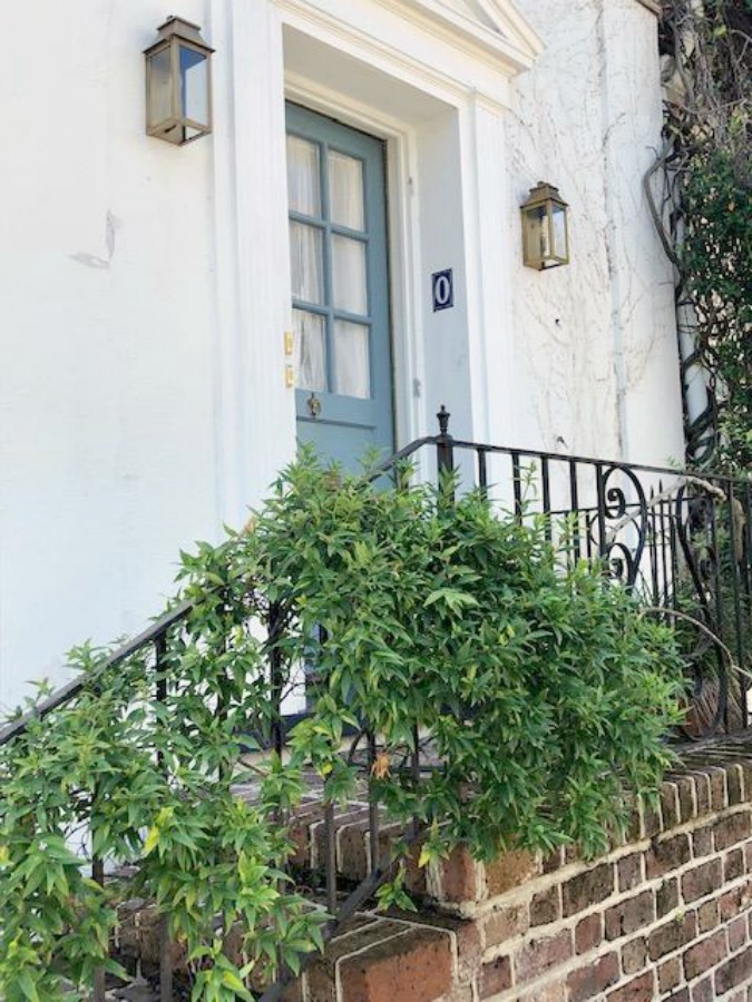 In the Battery area of Charleston, beautiful antebellum mansions with charming gardens, gates, and colorful front doors inspire with their curb appeal - Hello Lovely Studio