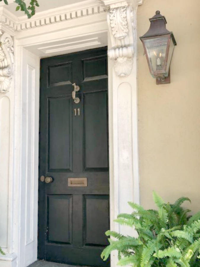 In the Battery area of Charleston, beautiful antebellum mansions with charming gardens, gates, and colorful front doors inspire with their curb appeal - Hello Lovely Studio