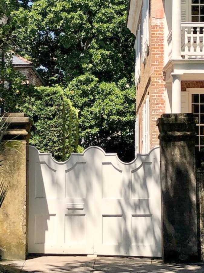 In the Battery area of Charleston, beautiful antebellum mansions with charming gardens, gates, and colorful front doors inspire with their curb appeal - Hello Lovely Studio