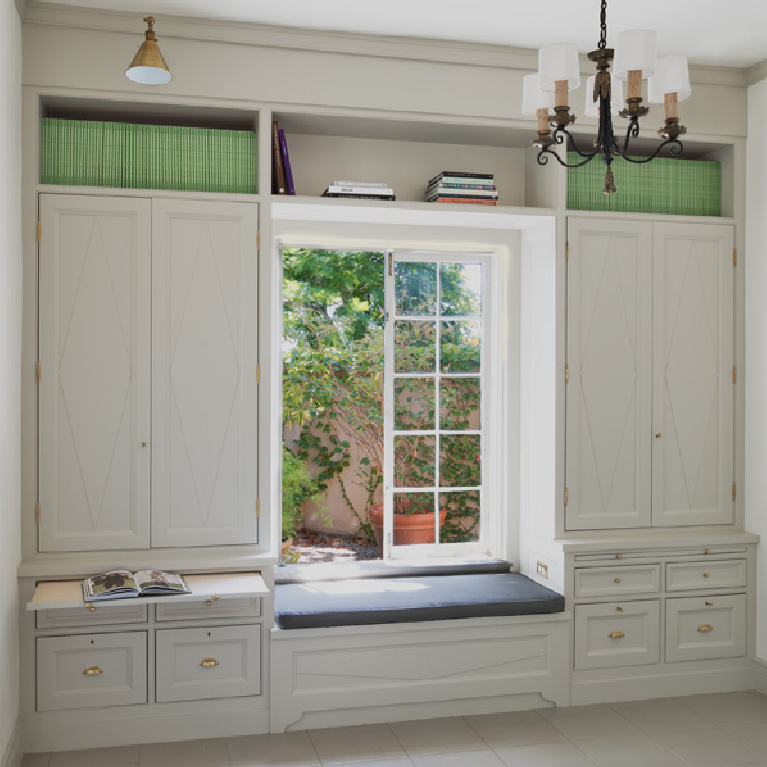 Pavilion Gray paint color by Farrow & Ball on built-ins and window seat in a glorious kitchen by Cynthia Carlson Associates. #paintcolors #paviliongray #farrowandball #builtins #mudroom #windowseat #graycabinets