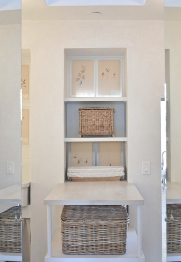 Patina Farm laundry room with rustic french farmhouse baskets, on the wall drying rack, and plaster walls. Design: Giannetti Home and photo via Velvet and Linen.