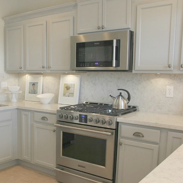 Kitchenaid smudgeproof stainless range and Viatera quartz in Soprano. Shop my kitchen and find a helpful resource Guide For a Decidedly Simple Serene Grey Kitchen in Arizona!