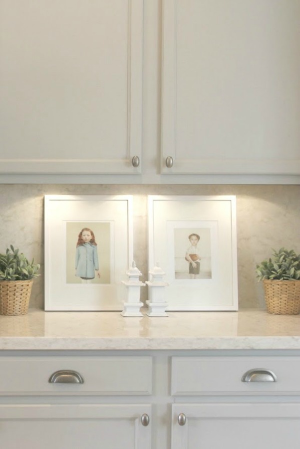 As real life renovators, we made over our ugly Arizona kitchen with no demo or dust with smart upgrades and swaps. Light grey cabinets, Viatera quartz counters (Soprano), and calacatta marble hex accent wall - Hello Lovely studio.