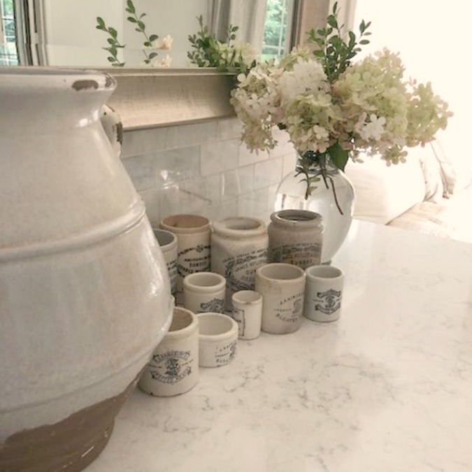 A mix of whites in my timelessly tranquil kitchen with European country decor, Viatera Minuet quartz, and Belgian linen - Hello Lovely Studio.