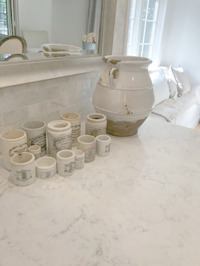 A mix of whites in my timelessly tranquil kitchen with European country decor, Viatera Minuet quartz, and Belgian linen - Hello Lovely Studio. COME SEE Timeless Kitchen Design Ideas and Decor to Freshen Your Traditional, Farmhouse, as well as French Country Kitchen.