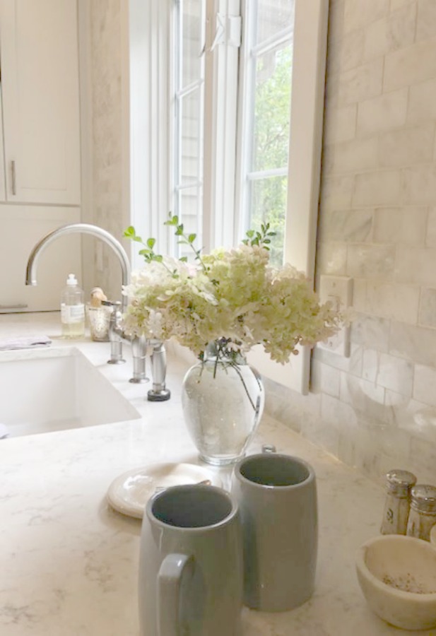 A mix of whites in my timelessly tranquil kitchen with European country decor, Viatera Minuet quartz, and Belgian linen - Hello Lovely Studio. COME SEE Timeless Kitchen Design Ideas and Decor to Freshen Your Traditional, Farmhouse, as well as French Country Kitchen.