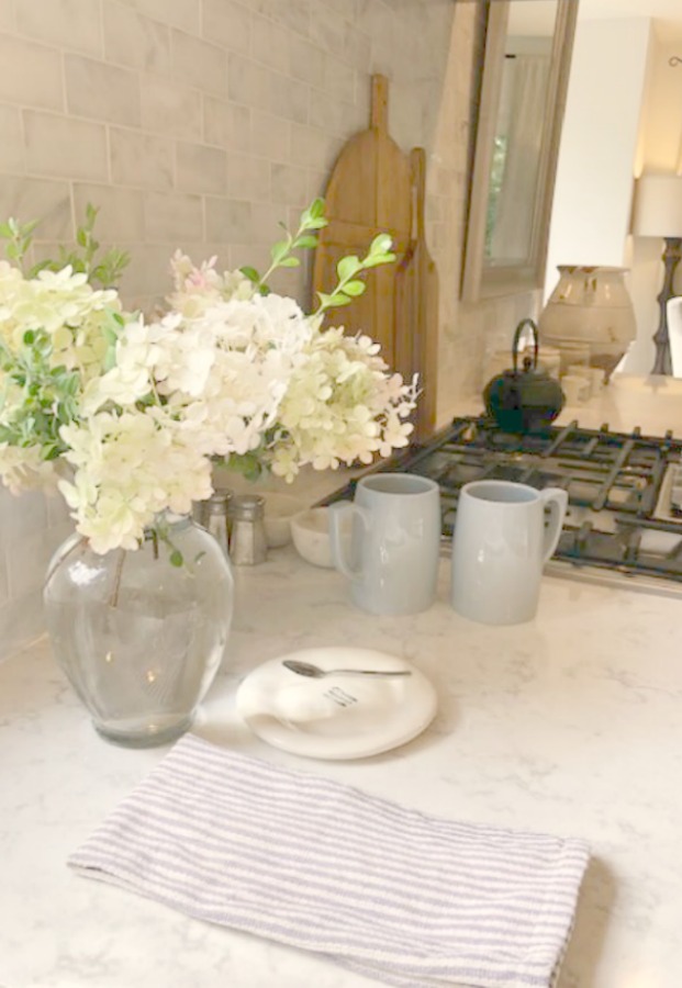 A mix of whites in my timelessly tranquil kitchen with European country decor, Viatera Minuet quartz, and Belgian linen - Hello Lovely Studio.