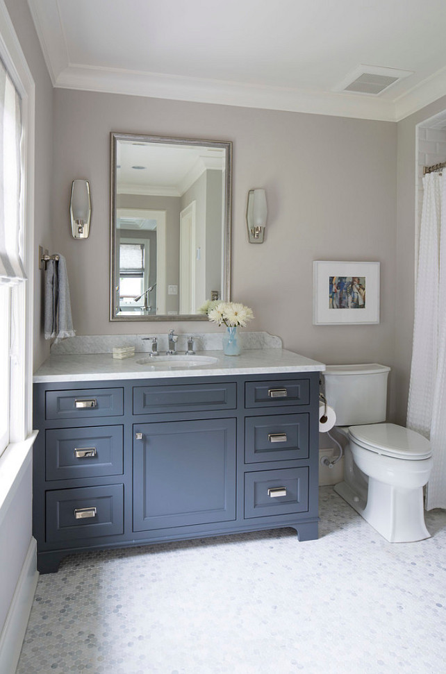 Beautiful navy blue bathroom vanity painted Farrow and Ball French Beret (a navy blue) and walls painted Cornforth White. Martha O'Hara Interiors.