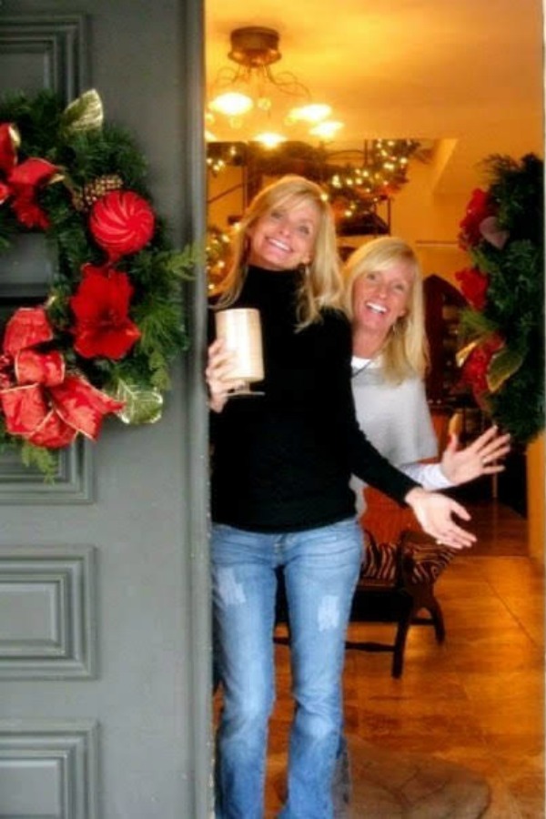 Blonde women at front door with holiday wreath - Hello Lovely Studio.