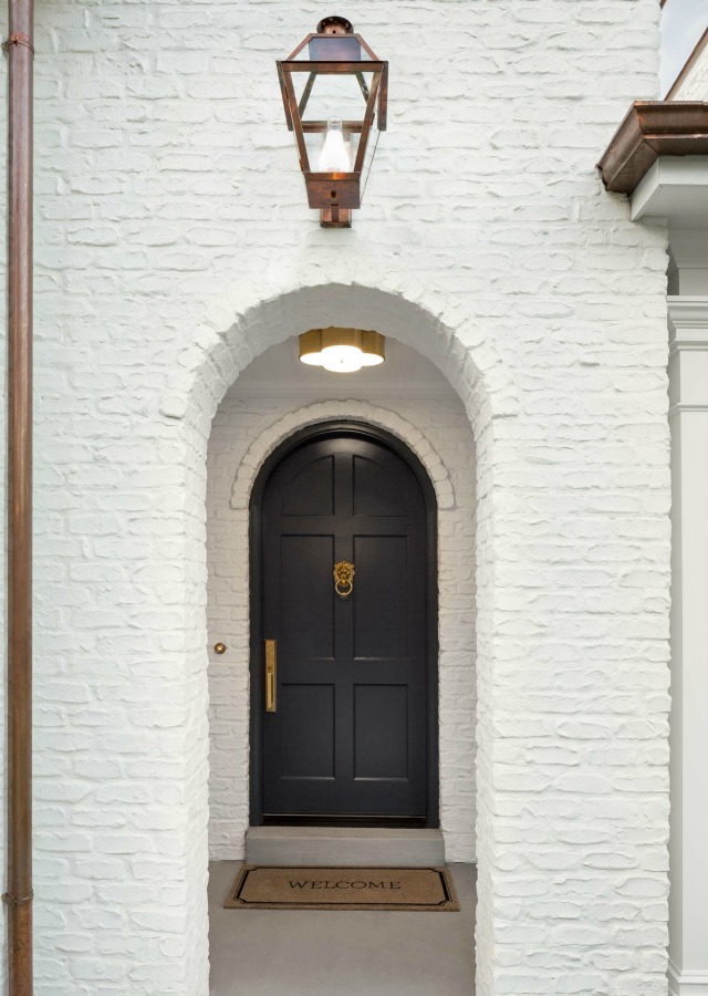 White painted brick exterior on a modern Tudor style home by The Fox Group. Click through for 9 Tranquil, Traditional, Timeless Interior Design Ideas & Inspiring House Exteriors: The Fox Group!