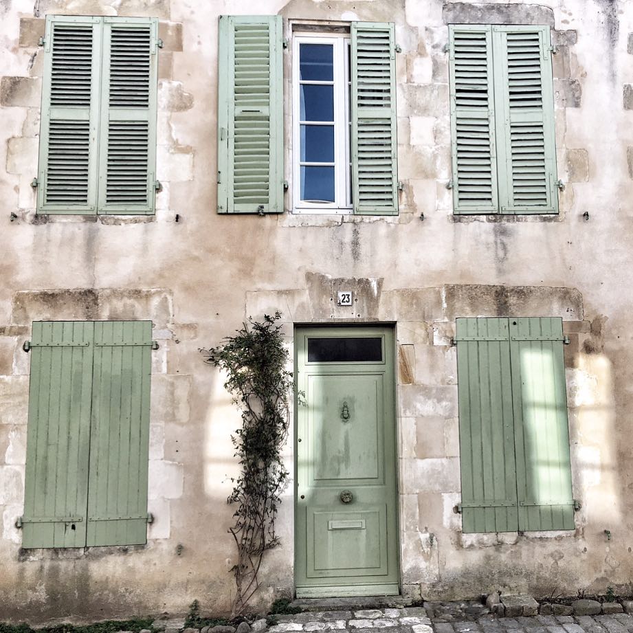 Charming and rustic French farmhouse exterior with Vert Olivier Green Shutters - photo by Vivi et Margot.