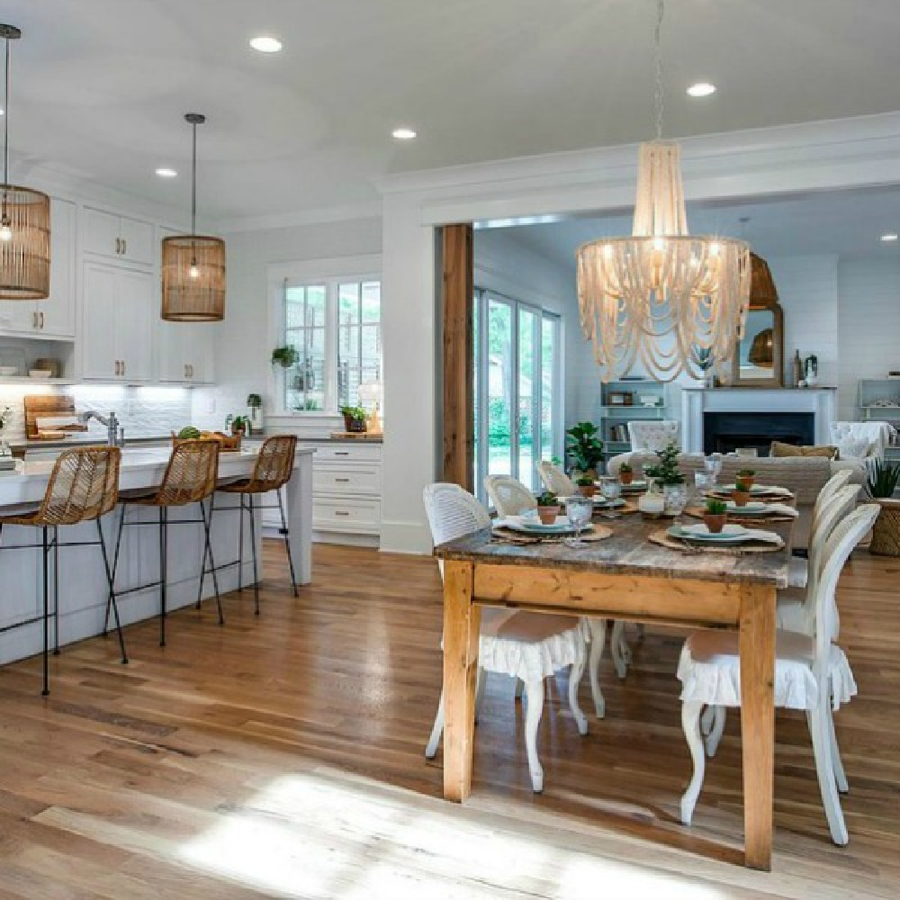 Breezy southern beachy charm in a white kitchen and breakfast area with plenty of natural finishes and hardwoods in a Tennessee cottage.