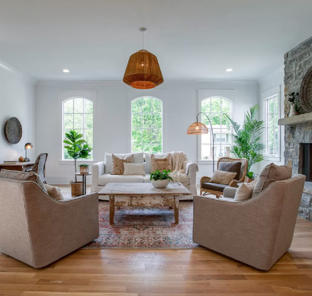 Rustic elegant cottage style in a breezy den with arched windows and laid back furnishings in Franklin, TN.