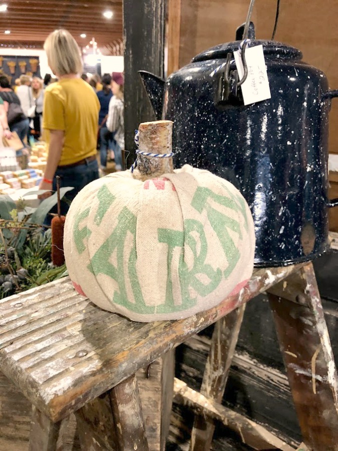 Vintage grainsack covered pumpkin. Vintage style, farmhouse decor, and junkin paradise in the fall - Main Street Market (Urban Farmgirl) in Belvidere, IL - Hello Lovely Studio. #fleamarket #vintage #farmhouse #countrydecor #midwest