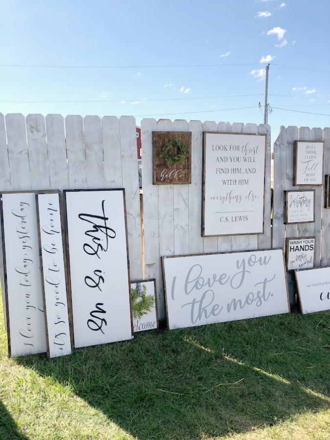 Hand-lettered signs with messages of faith. Come discover rustic fall decorating ideas in this photo gallery with ideas and resources! Vintage style, farmhouse decor, and junkin paradise in the fall - Main Street Market (Urban Farmgirl) in Belvidere, IL - Hello Lovely Studio. #fleamarket #vintage #farmhouse #countrydecor #midwest