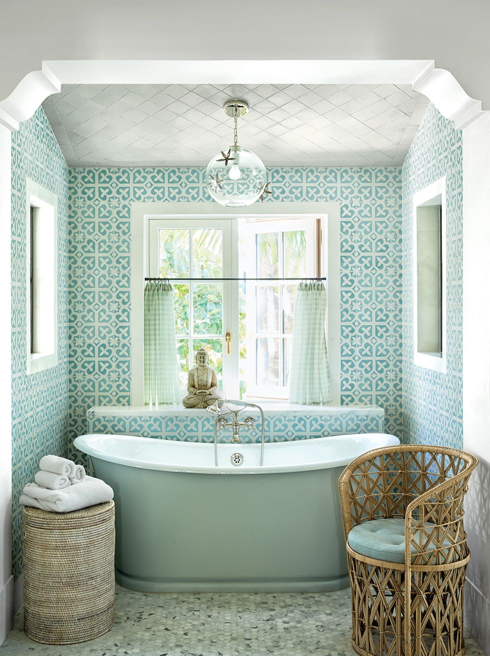 Breathtaking aqua tile and luxurious freestanding tub in a coastal home with interior design by Tom Scheerer. Photo by Francesco Lagnese - source: Elle Decor. Timeless Tastemaker Trifecta: Lisa Fine, Tom Scheerer and Miguel Flores-Vianna...in case you admire sophisticated design.