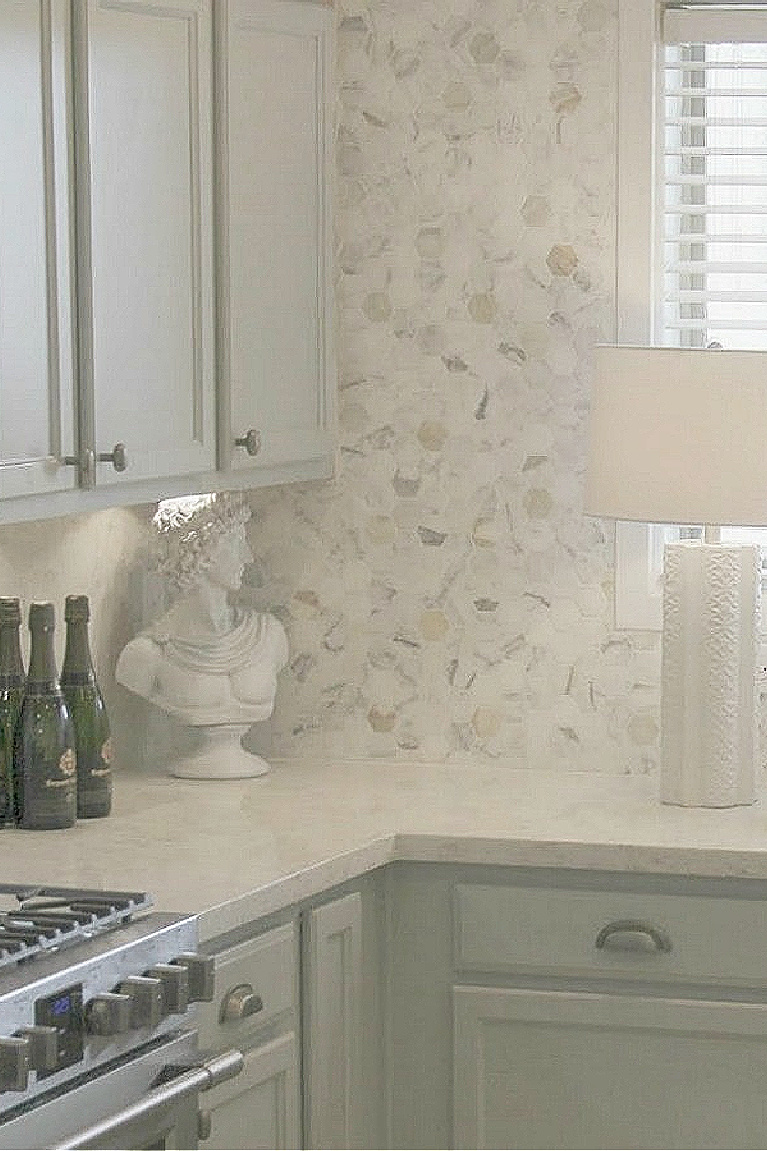 Behr Classic Silver paint color on kitchen cabinets in Hello Lovely's serene kitchen makeover with Viatera Soprano quartz. #hellolovelystudio #kitchendesign #paintcolors #behrclassicsilver #viaterasoprano #quartzcountertop #quartzbacksplash #kitchenaidappliances